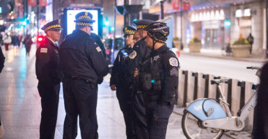Police talk on the streets of Chicago on Nov. 6, 2024.