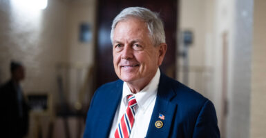 Rep. Ralph Norman, R-S.C., walks down a hallway in the Capitol.