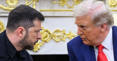 Zelenskyy and Donald Trump meet in the Oval Office in front of the fireplace mantle