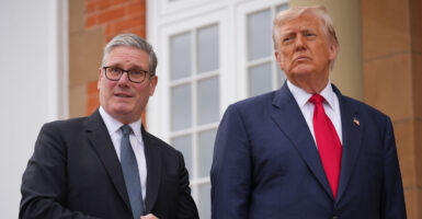 Keir Starmer and Donald Trump stand beside each other while speaking to reporters.