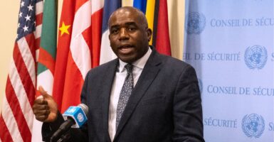 David Lammy speaks into a microphone.