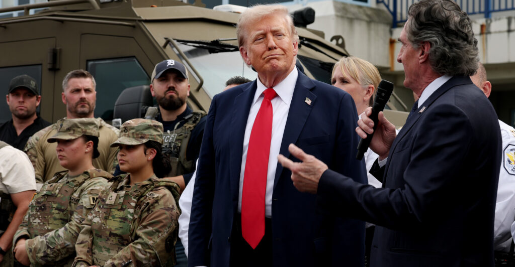 U.S. President Donald Trump speaks to law enforcement officers alongside Interior Secretary Doug Burgum (R) at the U.S. Park Police Anacostia Operations Facility on August 21, 2025 in Washington, DC.