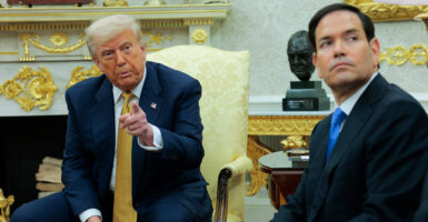 President Donald Trump and Secretary of State Marco Rubio sit in the Oval Office.