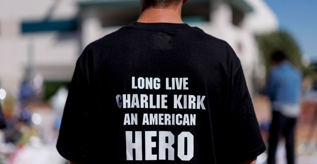 A man visits a memorial for Charlie Kirk at Turning Point USA headquarters Friday in Phoenix, Arizona. Kirk, the CEO and co-founder of Turning Point USA, was fatally shot Wednesday in Utah.