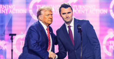 Charlie Kirk speaks with President Donald Trump at America Fest 2024 in Phoenix, Arizona, on Dec. 22, 2024.