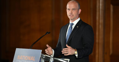 The president of the Heritage Foundation, Kevin Roberts, addresses attendees at the National Conservatism Conference on May 16, 2023, in London.