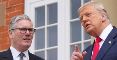 Close-up of Donald Trump pointing while talking to British Prime Minister Keir Starmer