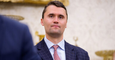 Charlie Kirk stands in the back of the Oval Office as President Donald Trump speaks at a swearing-in ceremony for the U.S. attorney for Washington, D.C., Jeanine Pirro, on May 28.