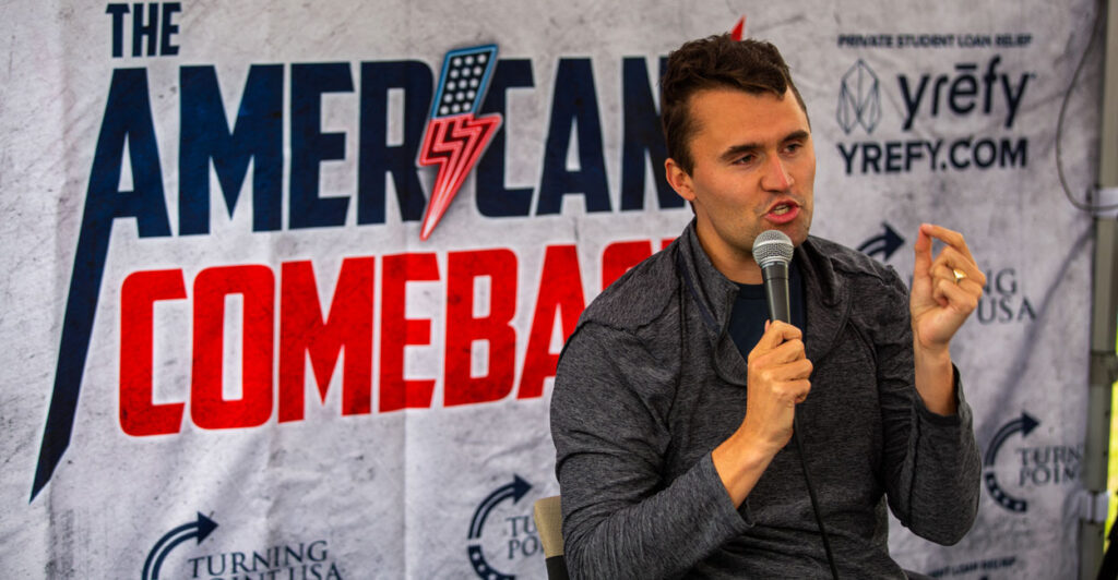Charlie Kirk jestures while speaking at an American Comeback event.