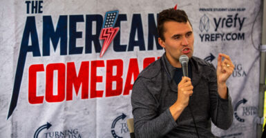 Charlie Kirk jestures while speaking at an American Comeback event.