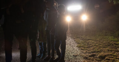 Unaccompanied alien children wait to be processed by Border Patrol agents after they crossed the Rio Grande in Roma, Texas, on April 29, 2021.