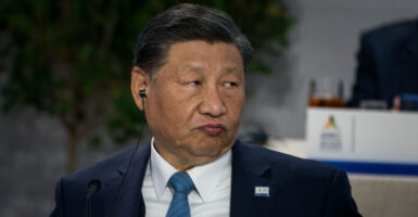 Close-up of Xi Jinping pursing his lips.