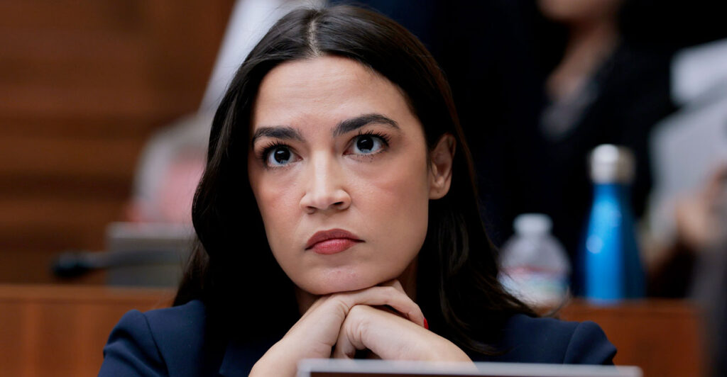 Alexandria Ocasio Cortez, who backs the congressional stock trading ban, is seen at House of Representatives hearing.