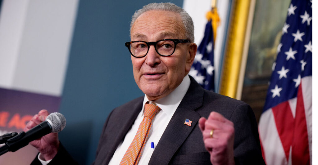 Chuck Schumer speaks at a lectern in the United States Capitol.