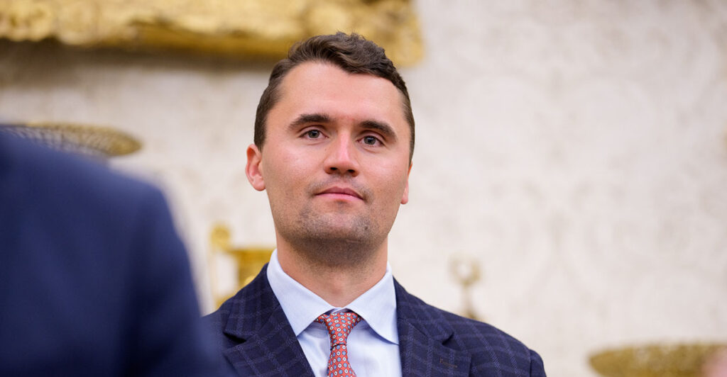 Charlie Kirk in a suit at the White House