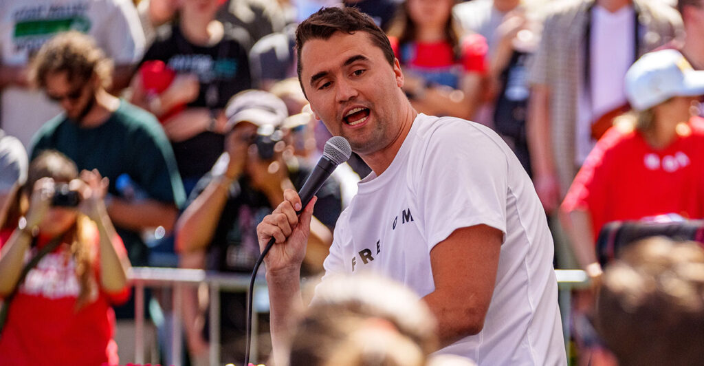 Charlie Kirk white t-shirt microphone