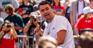 Charlie Kirk white t-shirt microphone