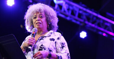 American political activist, academic and author Angela Davis reads a statement during NPR Music's Turning the Tables Live: The Motherlode as part of the Lincoln Center Out of Doors summer concert series at Damrosch Park, Lincoln Center on July 31, 2019 in New York City.