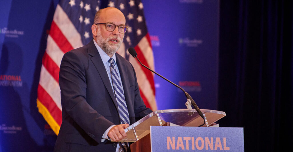 Russ Vought at NatCon podium.