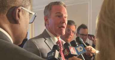 Sen. Jon Husted speaks to reporters.