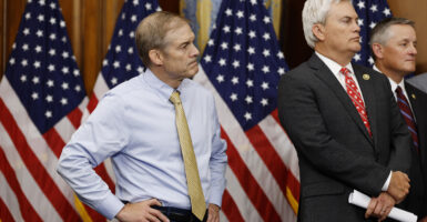 House Judiciary Committee Chairman Rep. Jim Jordan listens alongside House Oversight And Government Reform Committee Chairman Rep. James Comer at a news conference.