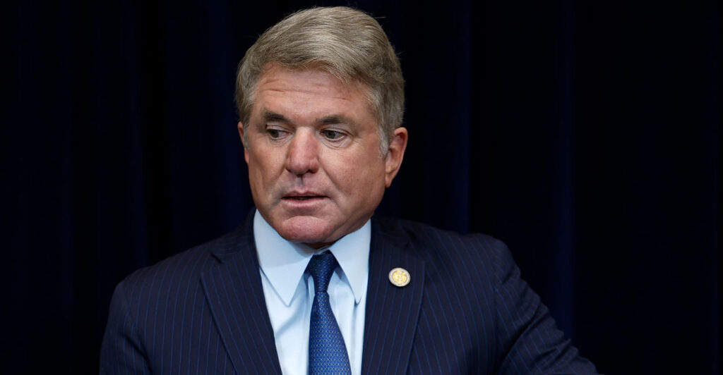 Michael McCaul, dressed in a suit, stands in the United States Capitol.
