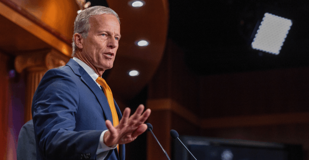 Thune speaks at a podium.