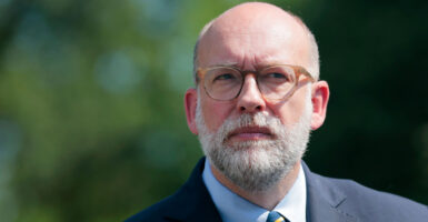 White House Budget Chief Rusell Vought speaks to the media in front of the White House.