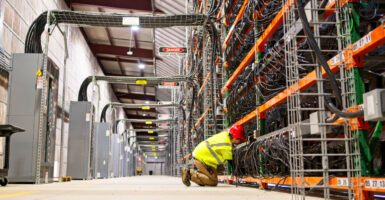 a worker inside a large data center