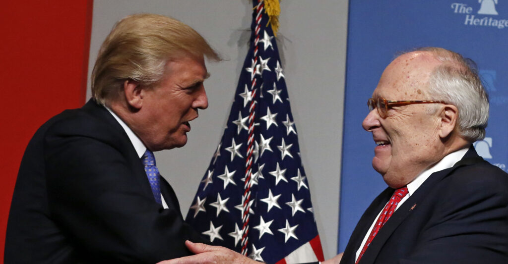 Heritage Foundation president and founder Ed Feulner (R) greets President Donald J. Trump.