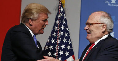 Heritage Foundation president and founder Ed Feulner (R) greets President Donald J. Trump.