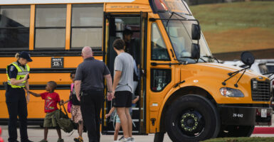 Students get off their school bus on the first day of school at Conroe ISD's Eissler Elementary School.