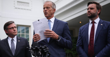John Thune, flanked by JD Vance and Mike Johnson outside the White House.