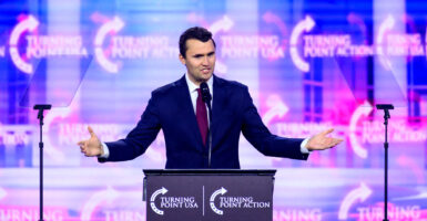 Turning Point USA founder Charlie Kirk speaks on stage at America Fest 2024 in Phoenix, Arizona, on Dec. 22, 2024.