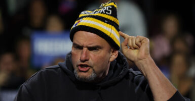 Wearing Pittsburgh Steelers gear, Sen. John Fetterman, D-Pa.—seen here speaking at a campaign rally for then-Democratic presidential nominee Kamala Harris on Oct. 14, 2024, in Erie, Pa.—this week criticized of some of her campaign rhetoric.