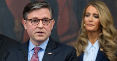With Kelly Loeffler, head of the Small Business Administration, looking on, House Speaker Mike Johnson, R-La., speaks at a Monday news conference at the Capitol on the federal government shutdown, now in its 27th day.