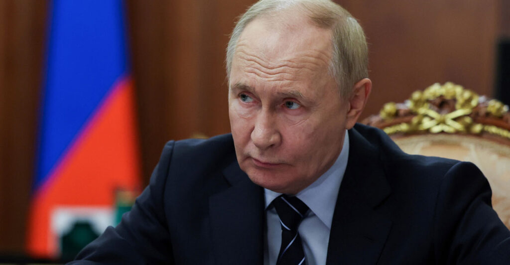 Russian President Vladimir Putin looks on as he meets with Russia's deputy prime minister in Moscow on Tuesday.