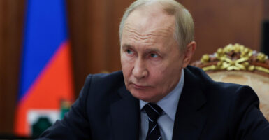 Russian President Vladimir Putin looks on as he meets with Russia's deputy prime minister in Moscow on Tuesday.