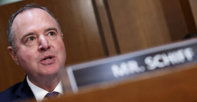 Sen. Adam Schiff behind a nameplate reading "Mr. Schiff" during a Senate hearing.