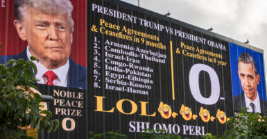 A billboard listing President Trump's many accomplishments compared to President Obama's zero accomplishments.
