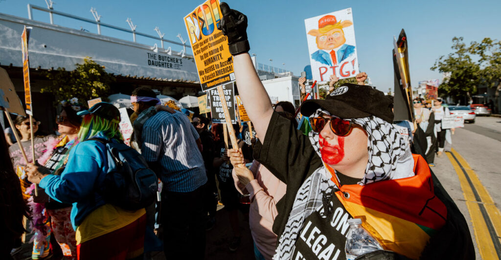 A woman raises her fist while marching during an International Women's Day protest in Los Angeles on March 8.