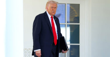 President Donald Trump walks in the rose garden at the white house to address senators on the shutdown.