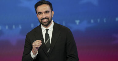 Democratic mayoral nominee Zohran Mamdani speaks during a mayoral debate at Rockefeller Center, looking directly at the camera.
