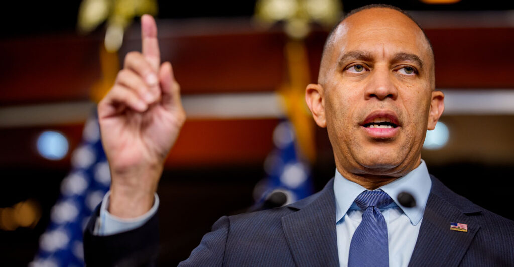 House Minority Leader Hakeem Jeffries, D-N.Y., pointing upward with his right index finger