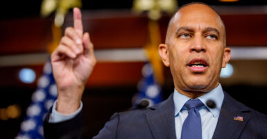 House Minority Leader Hakeem Jeffries, D-N.Y., pointing upward with his right index finger