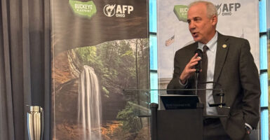 Speaker Matt Huffman speaks at the podium in front of AFP-Ohio sign.