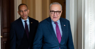 House Minority Leader Hakeem Jeffries (left) and Senate Minority Leader Chuck Schumer, both D-N.Y., walk through the Capitol.