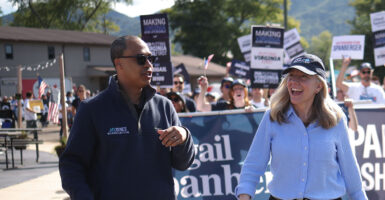 Virginia Democrat attorney general candidate Jay Jones walks with gubernatorial candidate Abigail Spanberger.