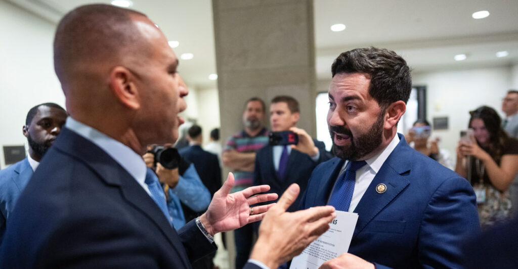 Hakeem Jeffries and Mike Lawler argue in the capitol.