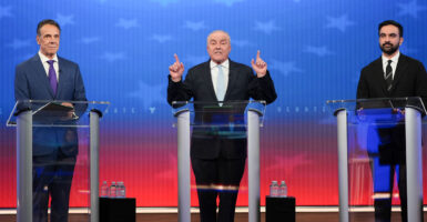 Republican nominee Curtis Sliwa (C) speaks alongside Independent nominee former, New York Gov. Andrew Cuomo (L) and Democratic nominee Zohran Mamdani during a mayoral debate.